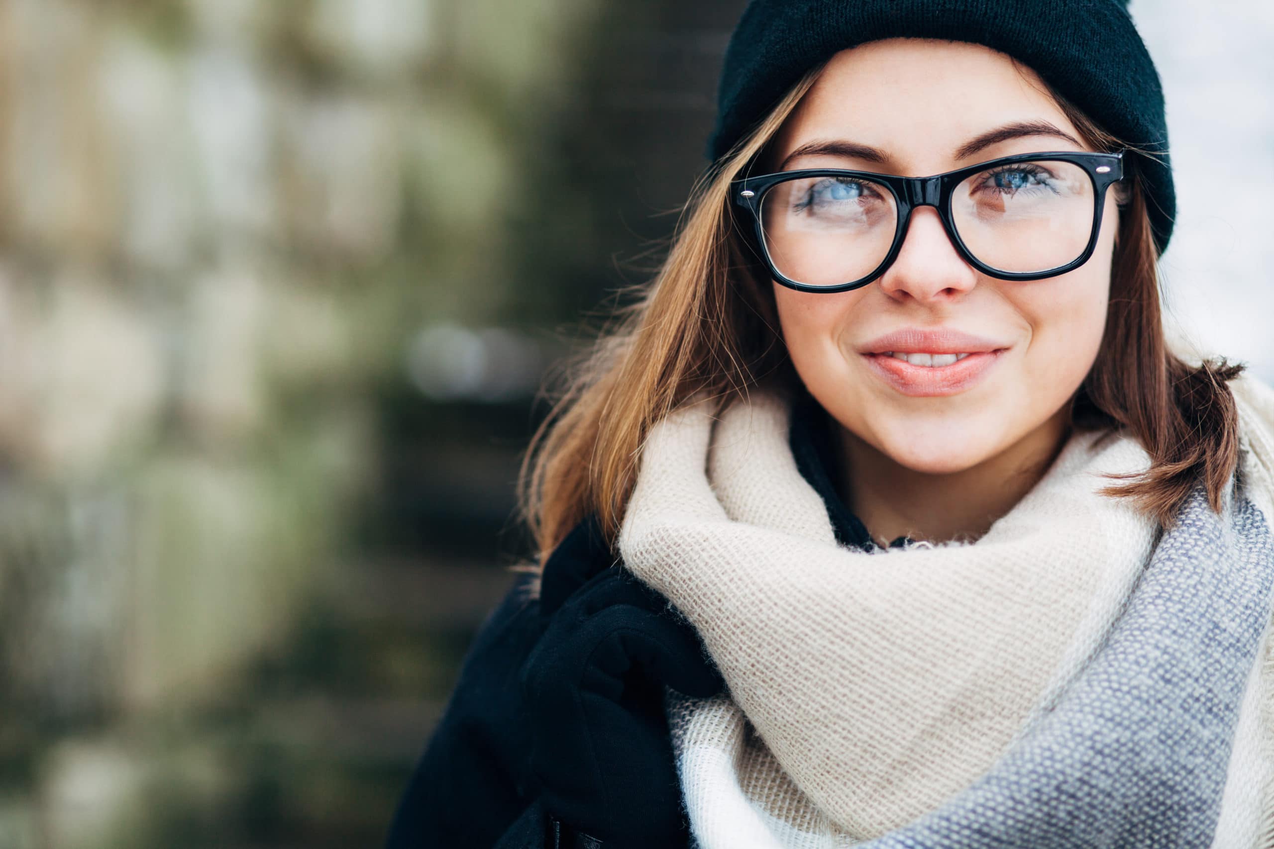 Young woman wearing glasses Outside